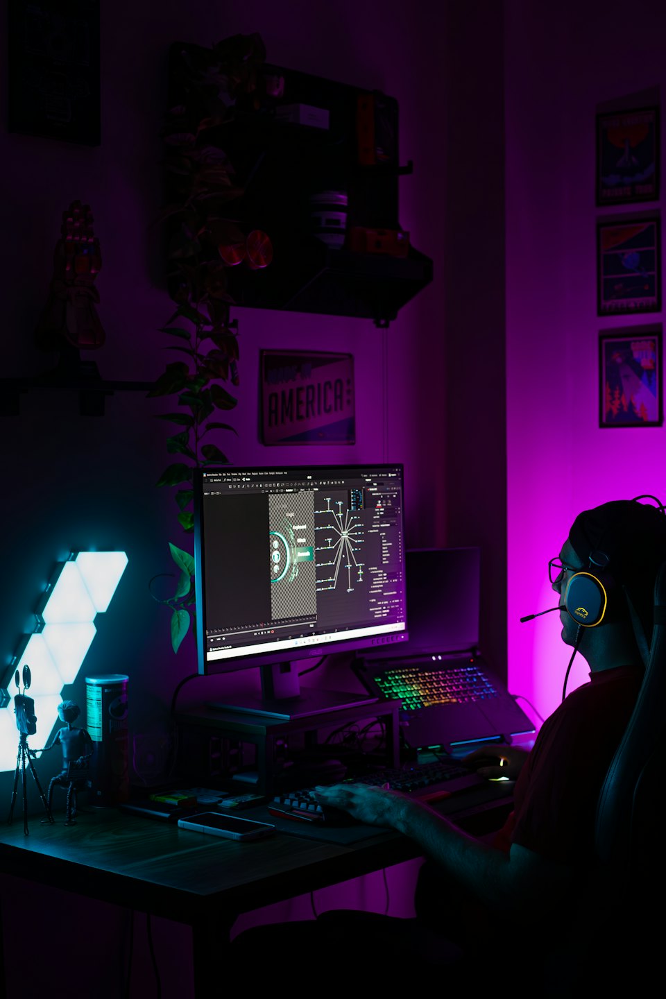 A professional uses a headset while working at a computer workstation.
